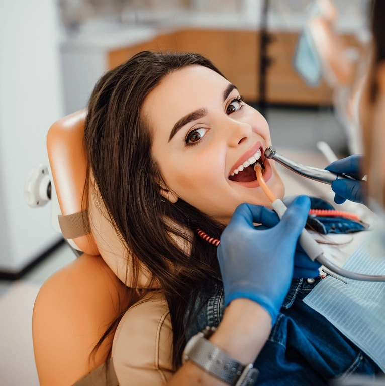 Happy patient after dental treatment at Diamond Dental & Implant Centre